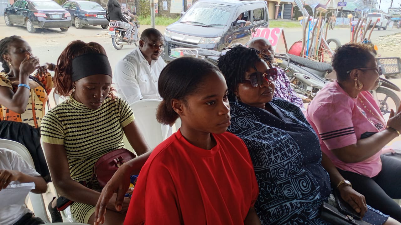 Guests listening to remarks at the Eket office opening